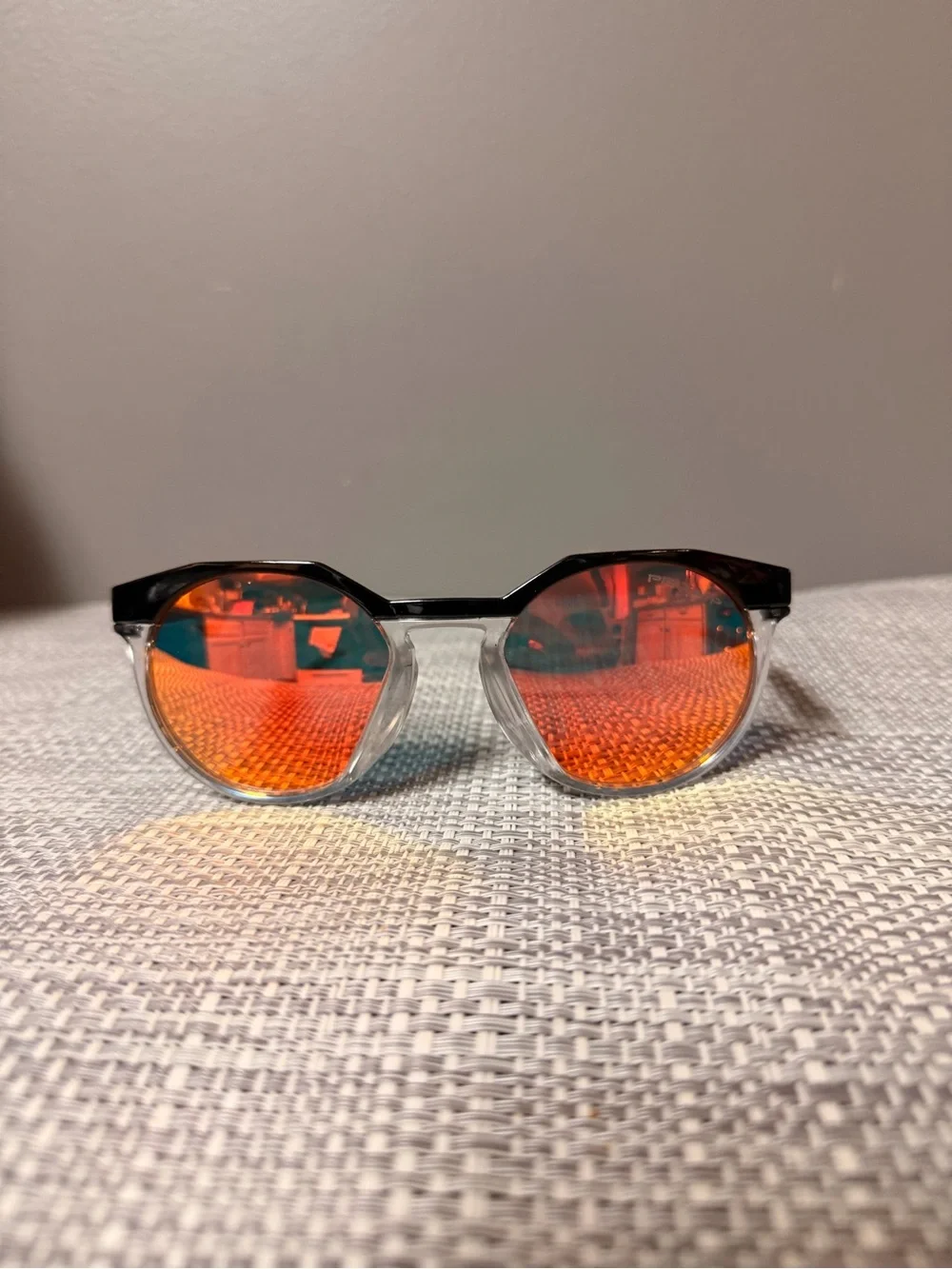 Oakley Clear Frame Sunglasses with Black Temples and Dark Lenses